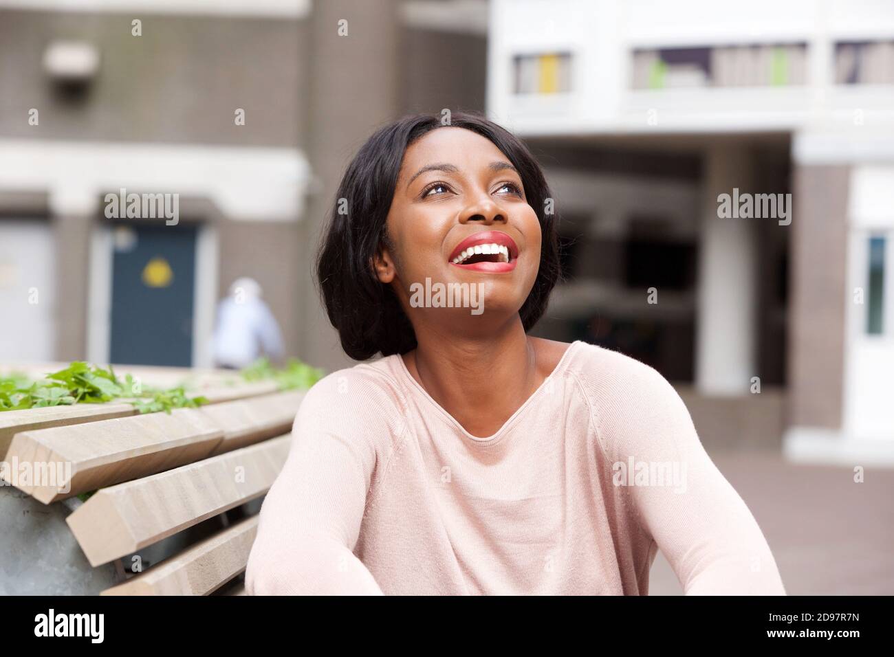 Close up portrait of young black woman laughing outside Stock Photo - Alamy