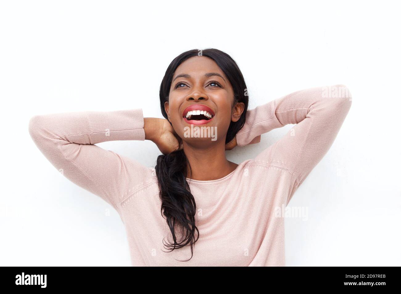 Close up portrait of beautiful young black woman laughing with hands ...