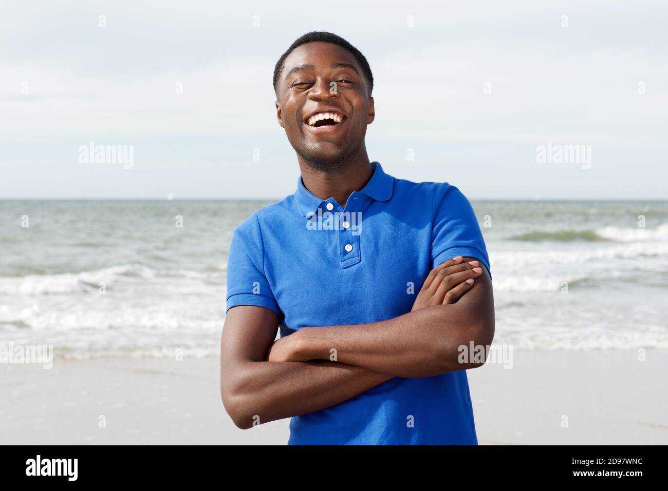 Happy young black man laughing hi-res stock photography and images - Alamy