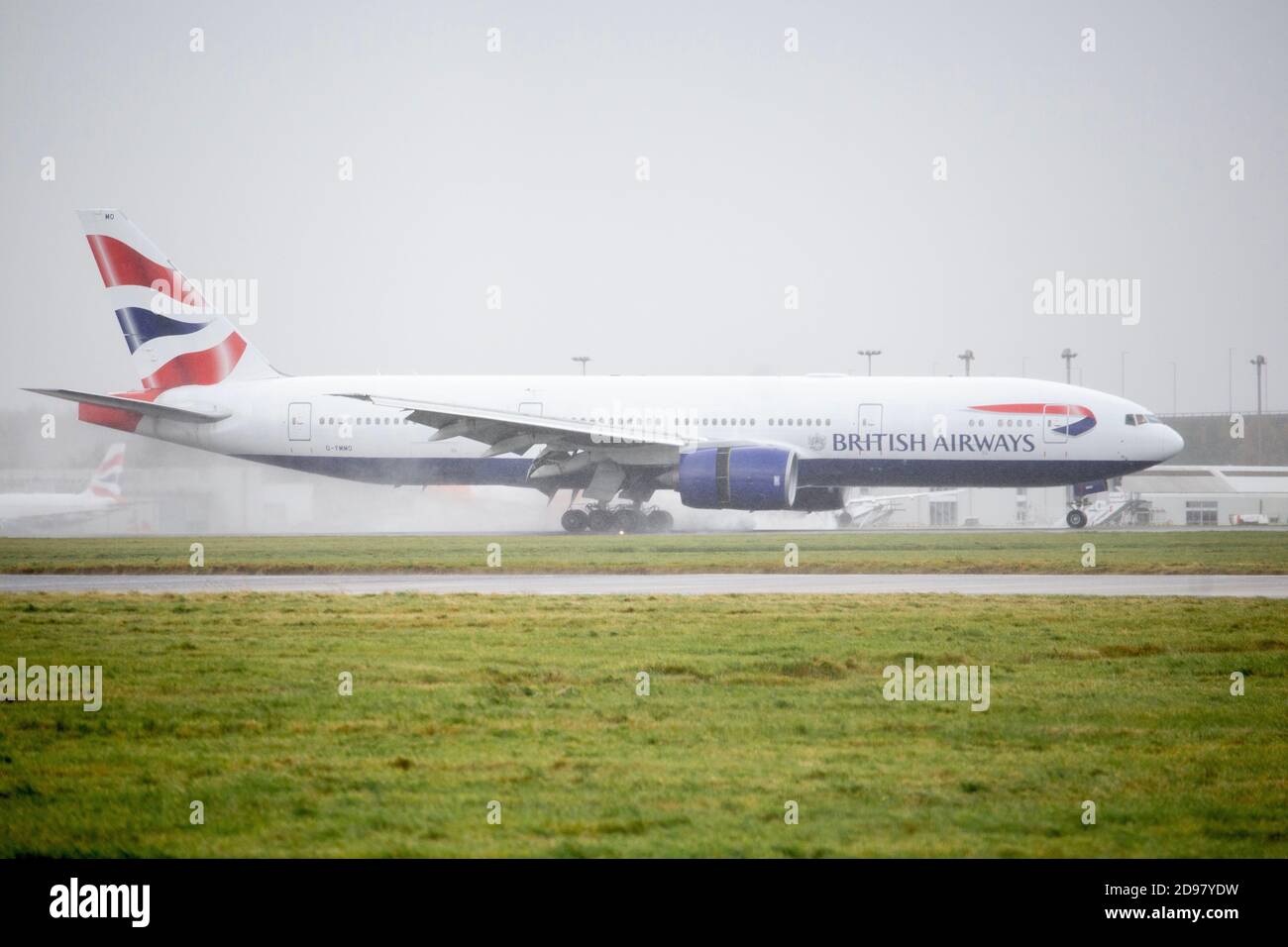 a British Airways 777-200 arrives into Glasgow Airport from Kuala Lumpur on a cargo operation. Stock Photo