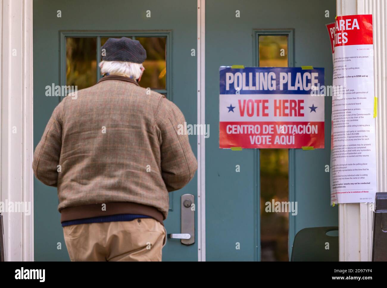 ARLINGTON, VIRGINIA, USA, NOVEMBER 3, 2020 - Man enters polling place during voting on presidential election day in northern Virginia. Credit: ©Rob Crandall/Alamy Live News Stock Photo