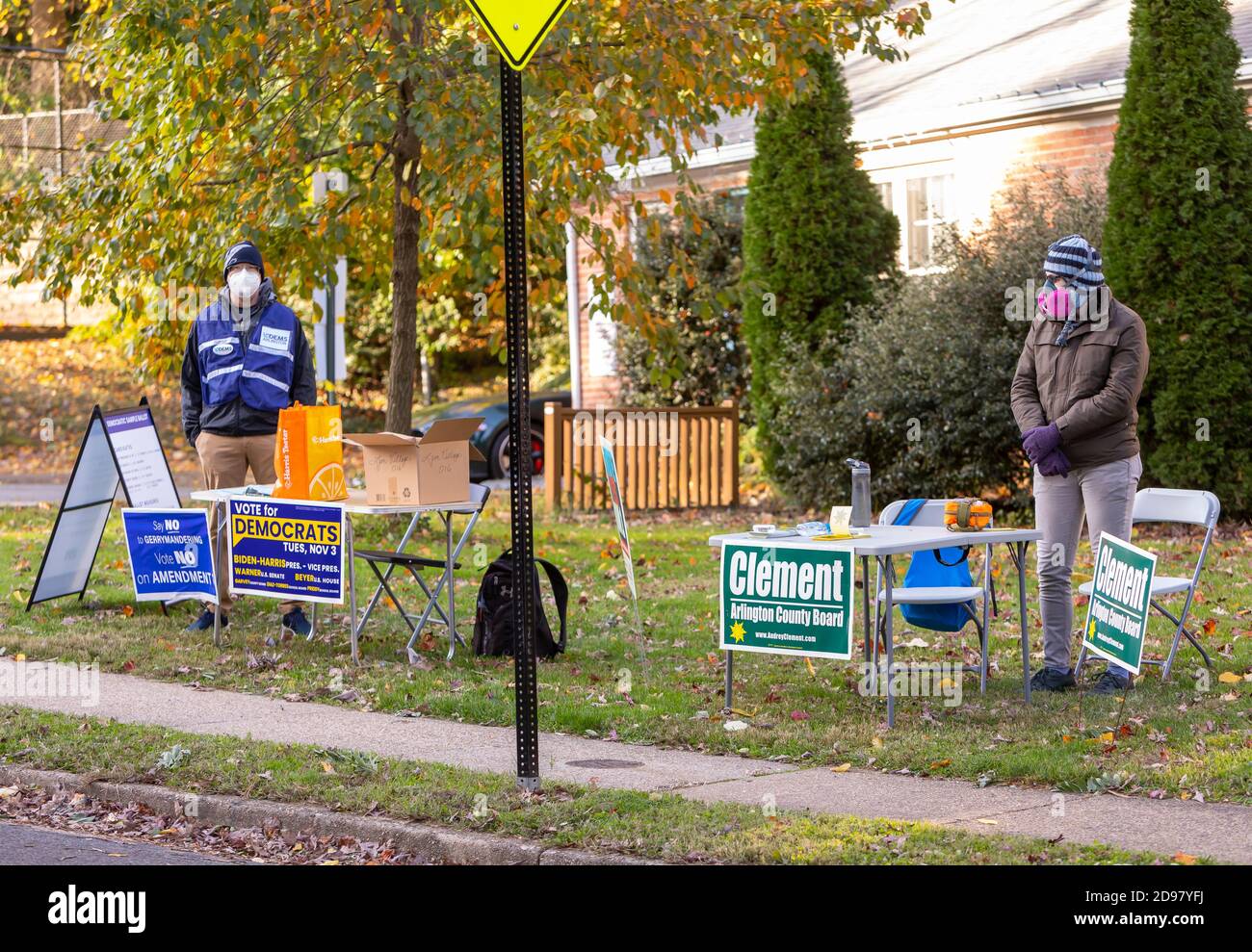 ARLINGTON, VIRGINIA, USA, NOVEMBER 3, 2020 - Men at tables with sample ballots wait for voters on presidential election day. Quiet due to early voting. Credit: ©Rob Crandall/Alamy Live News Stock Photo