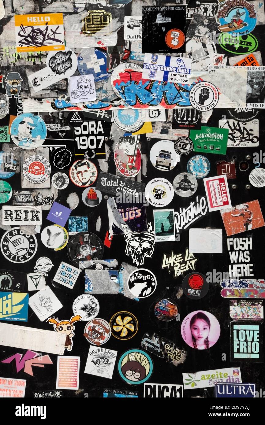 Stickers on black painted wall Stock Photo Alamy