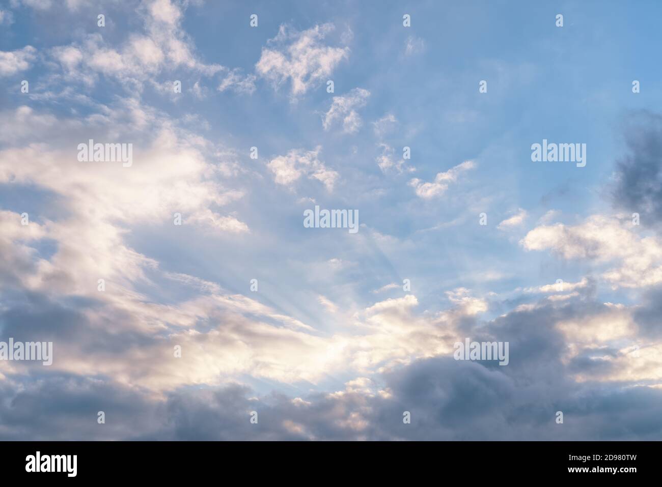 Sun rays in the dramatic cloudy sky. Natural texture and background Stock Photo