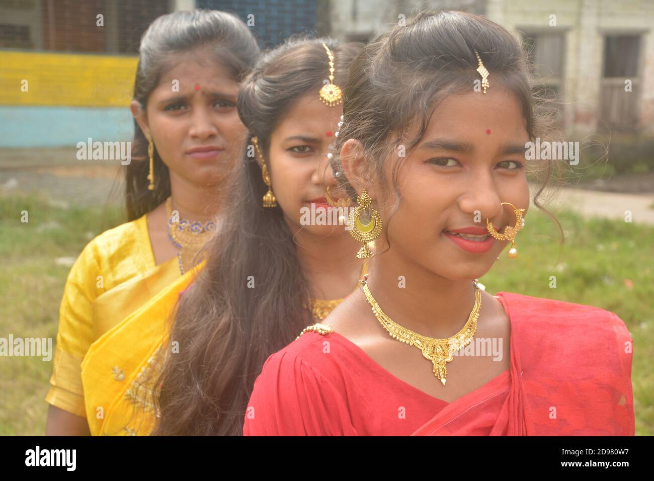 Close up of three teenage Indian girls wearing sari golden nose ring maang  tikka necklace earrings with make up, selective focusing Stock Photo - Alamy