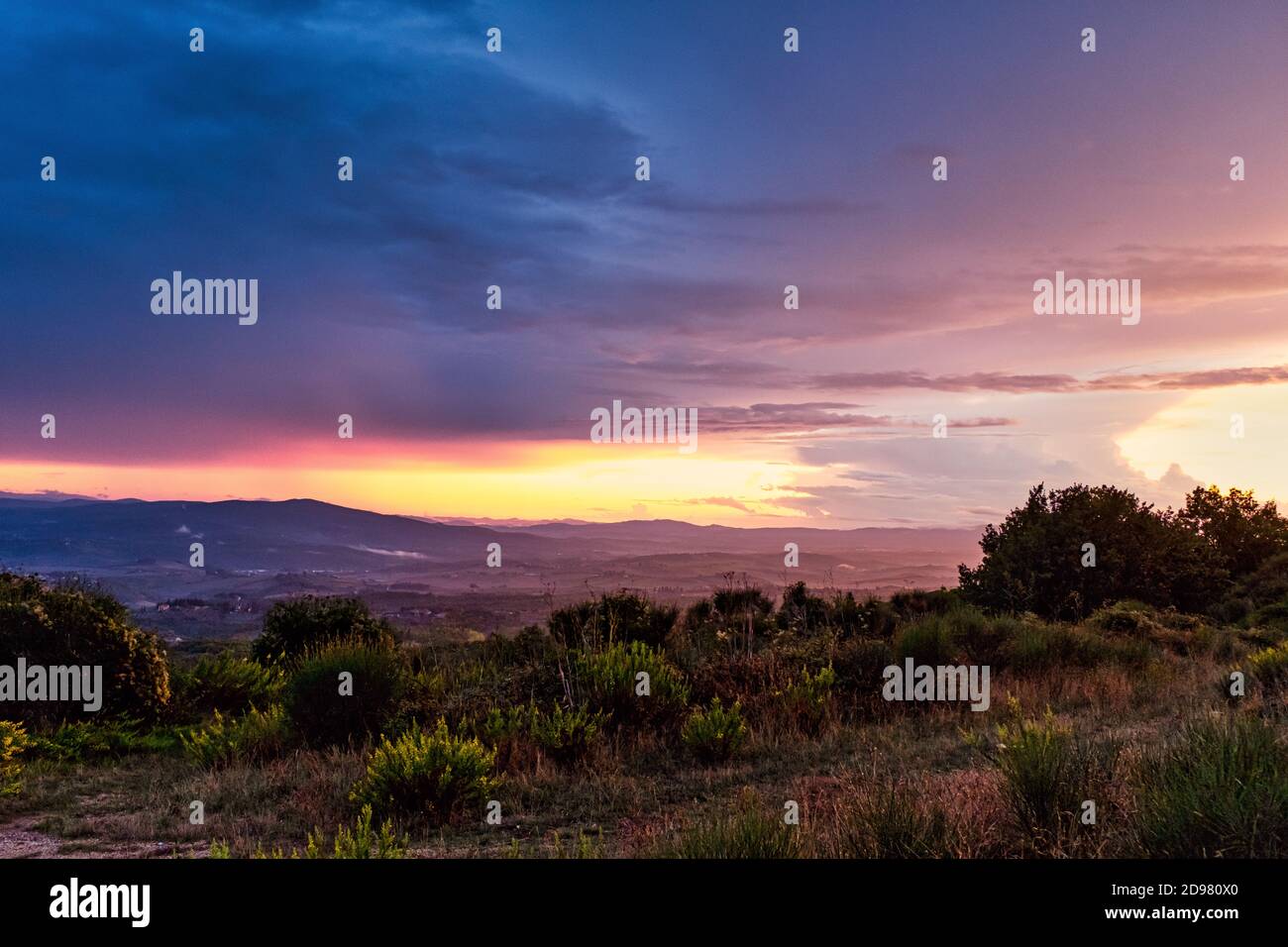Epic twilight sky with vivid colors in rural Tuscany, Italy. Stock Photo