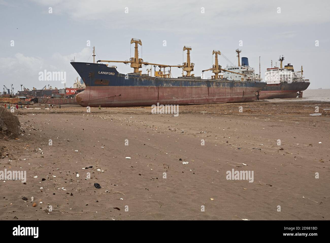 Alang, India, September 2008. Large tonnage cargo ship stranded on the beach waiting to be scrapped. Stock Photo
