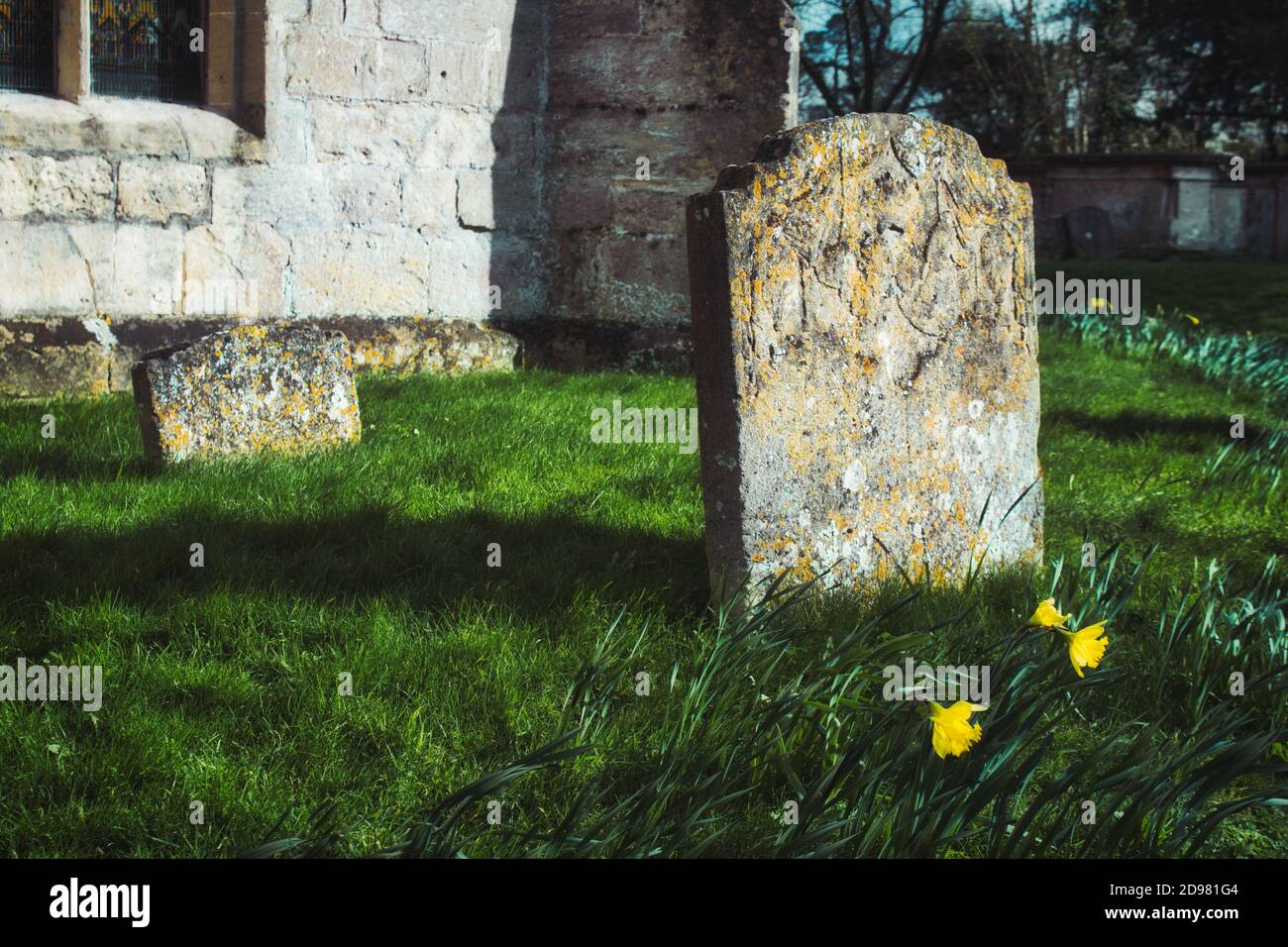 Blank gravestones in a typical churchyard in England Stock Photo