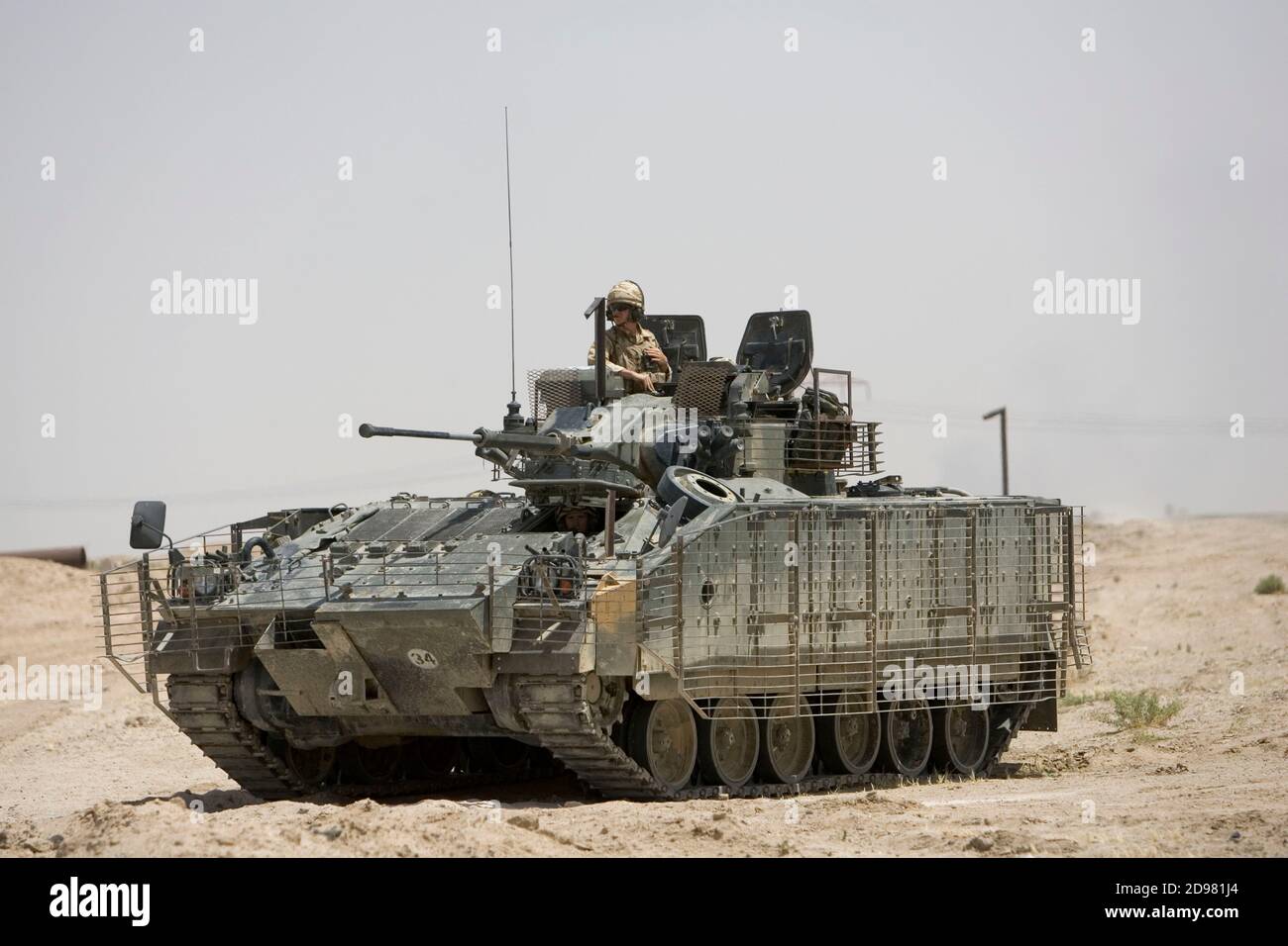 Members of the 1 Princess of Wales Royal Regiment, 20 Armoured Brigade patrol the road near Basra. Stock Photo