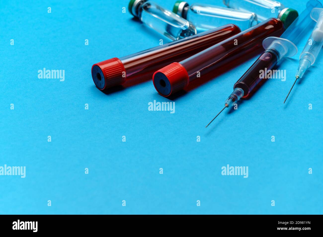 Syringe, test tubes with blood samples and ampoules with medicines or ...