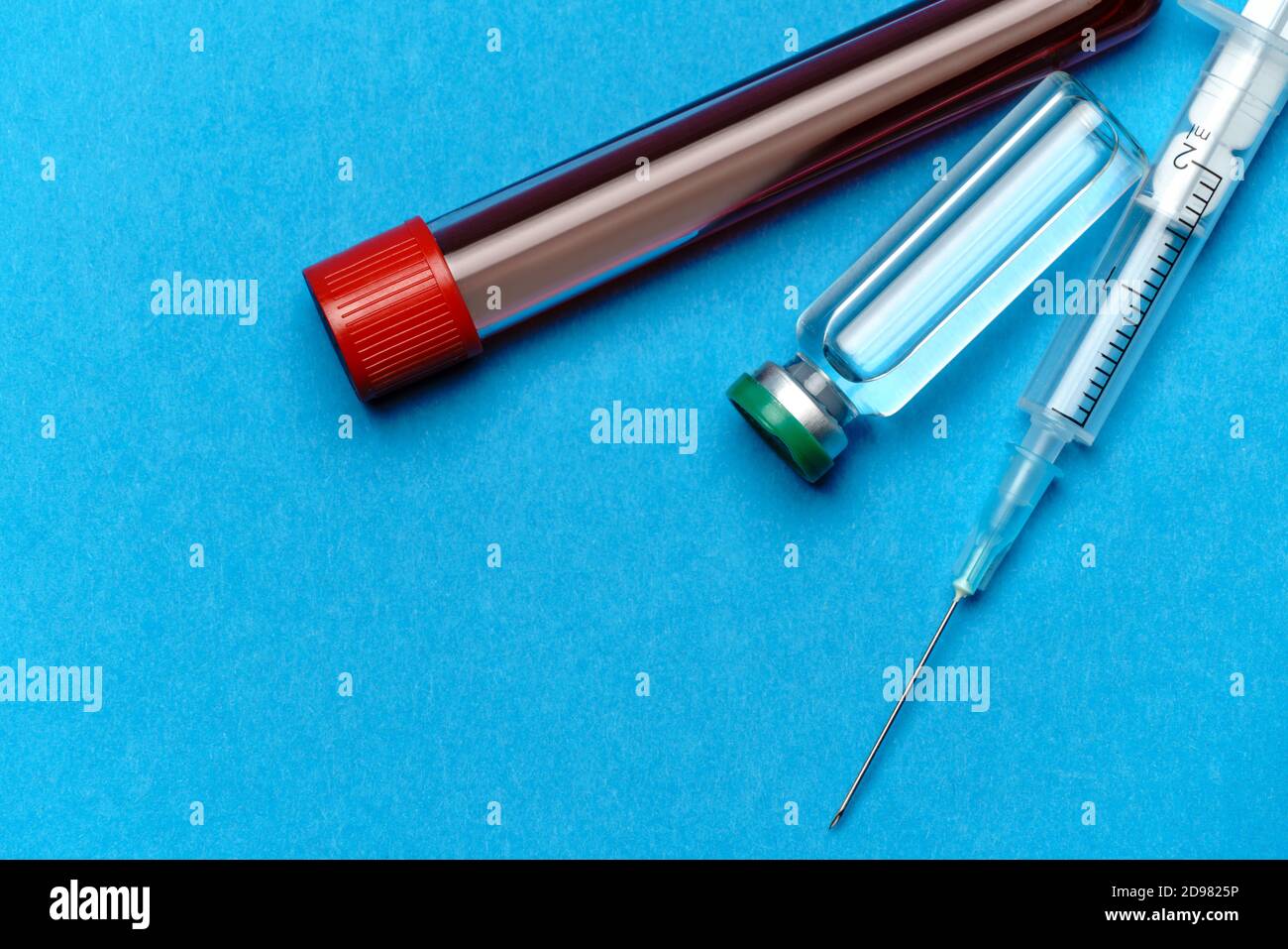 Syringe, test tubes with blood samples and ampoules with medicines or ...