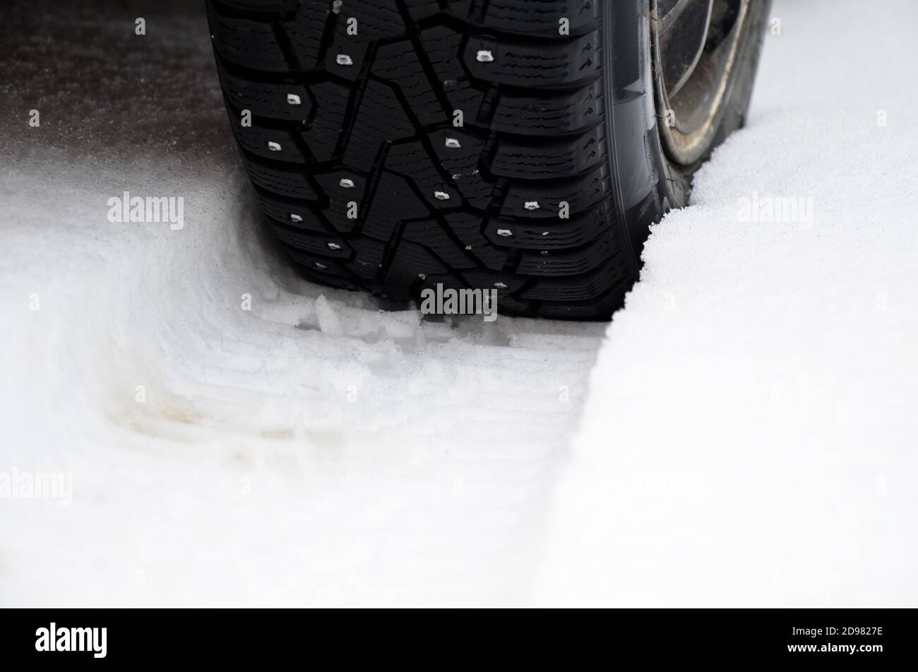 Closeup of car tires in winter on the road covered with snow Stock ...