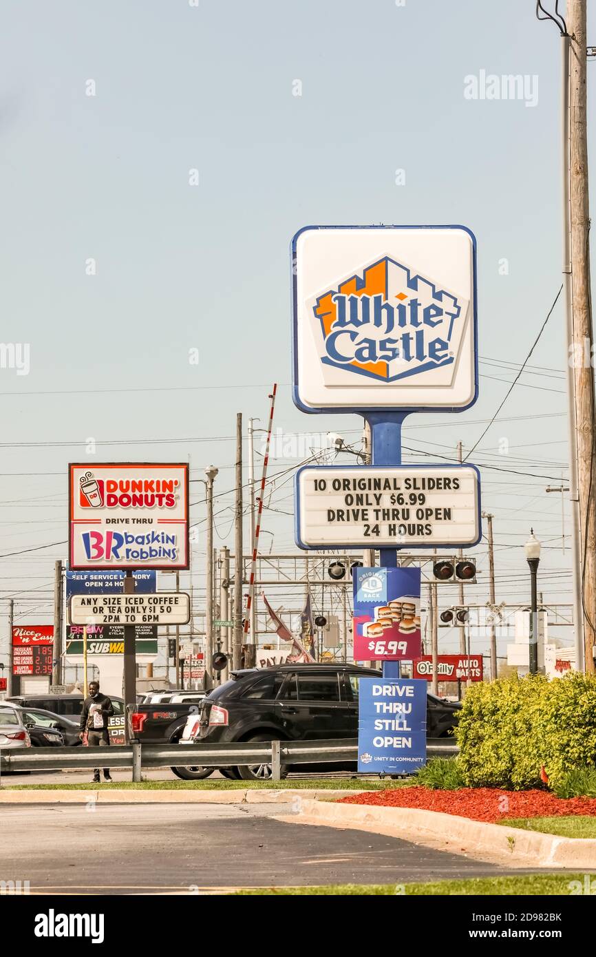 White castle sign and marquee with Dunkin' Donuts sign visible in the background. Stock Photo