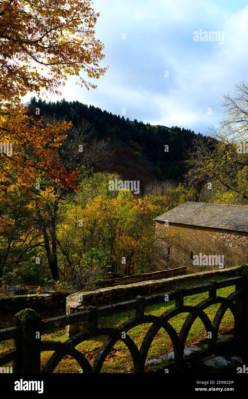 beautiful autumnal scene overlooking farm buidling in a valley in the cevennes mountains in southern france Stock Photo