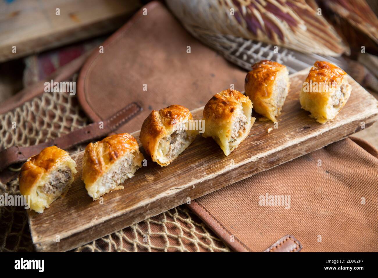 Pheasant sausage rolls made from minced pork and minced pheasant and herbs and spices. Made from a pheasant shot on a small driven shoot using a shotg Stock Photo