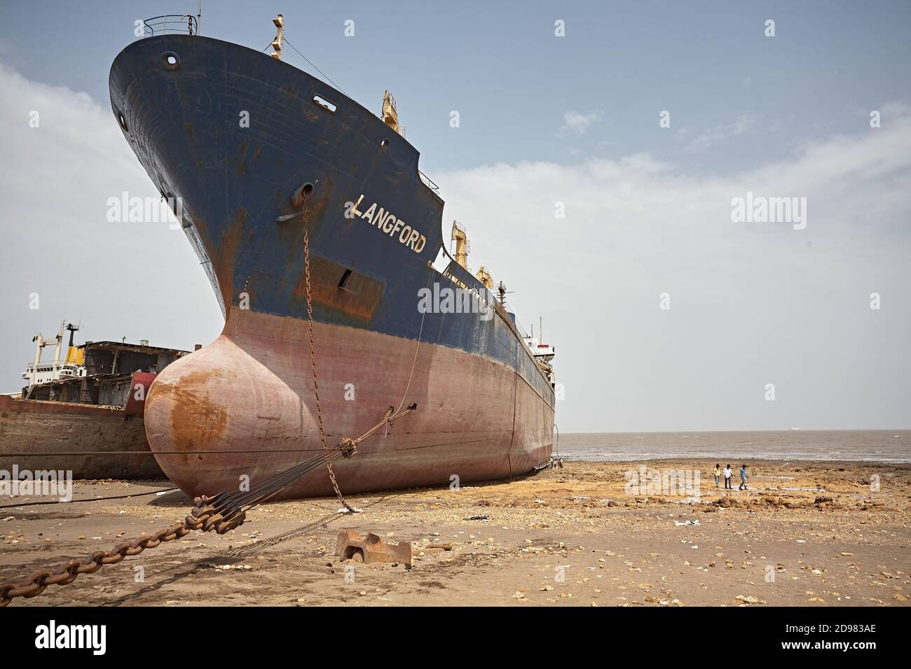 Alang, India, September 2008. Large tonnage cargo ship stranded on the beach waiting to be scrapped. Stock Photo