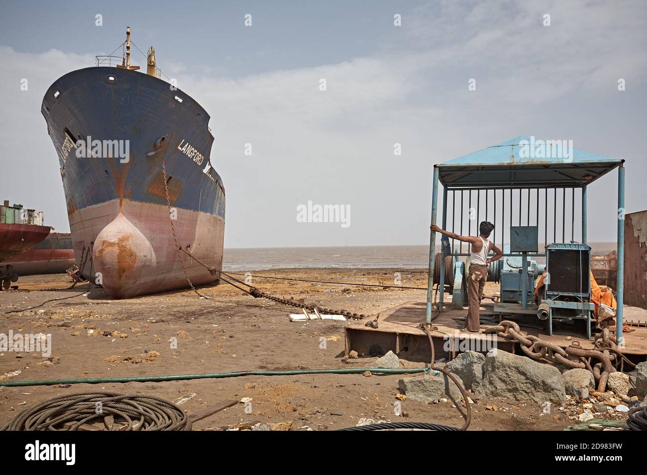 Alang, India, September 2008. Large tonnage cargo ship stranded on the beach waiting to be scrapped. Stock Photo