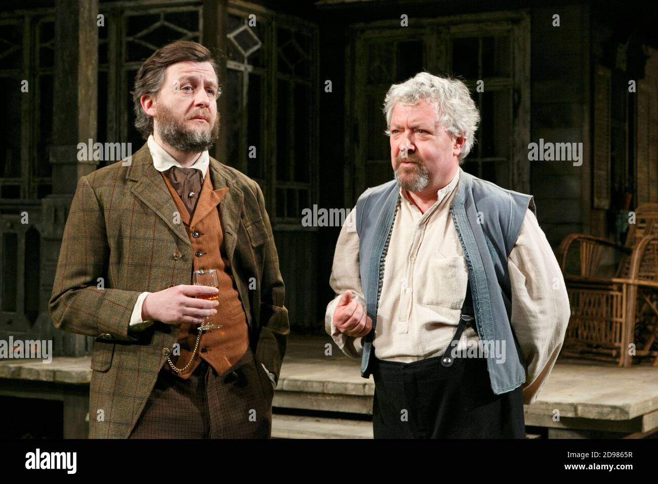 l-r: Alan Cox (Sergei), John Sessions (Dolzikhov) in LONGING by William Boyd  after Chekhov at the Hampstead Theatre, London NW3  07/03/2013  design: Lizzie Clachan  lighting: James Farncombe  director: Nina Raine Stock Photo