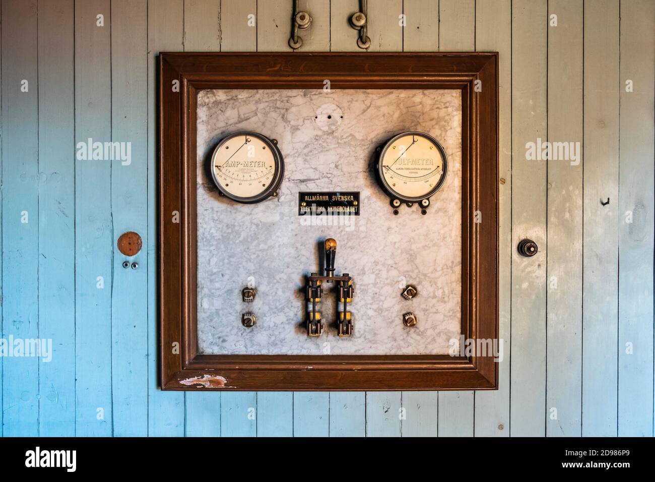 Old electrical indicating instrument on a marble panel Stock Photo