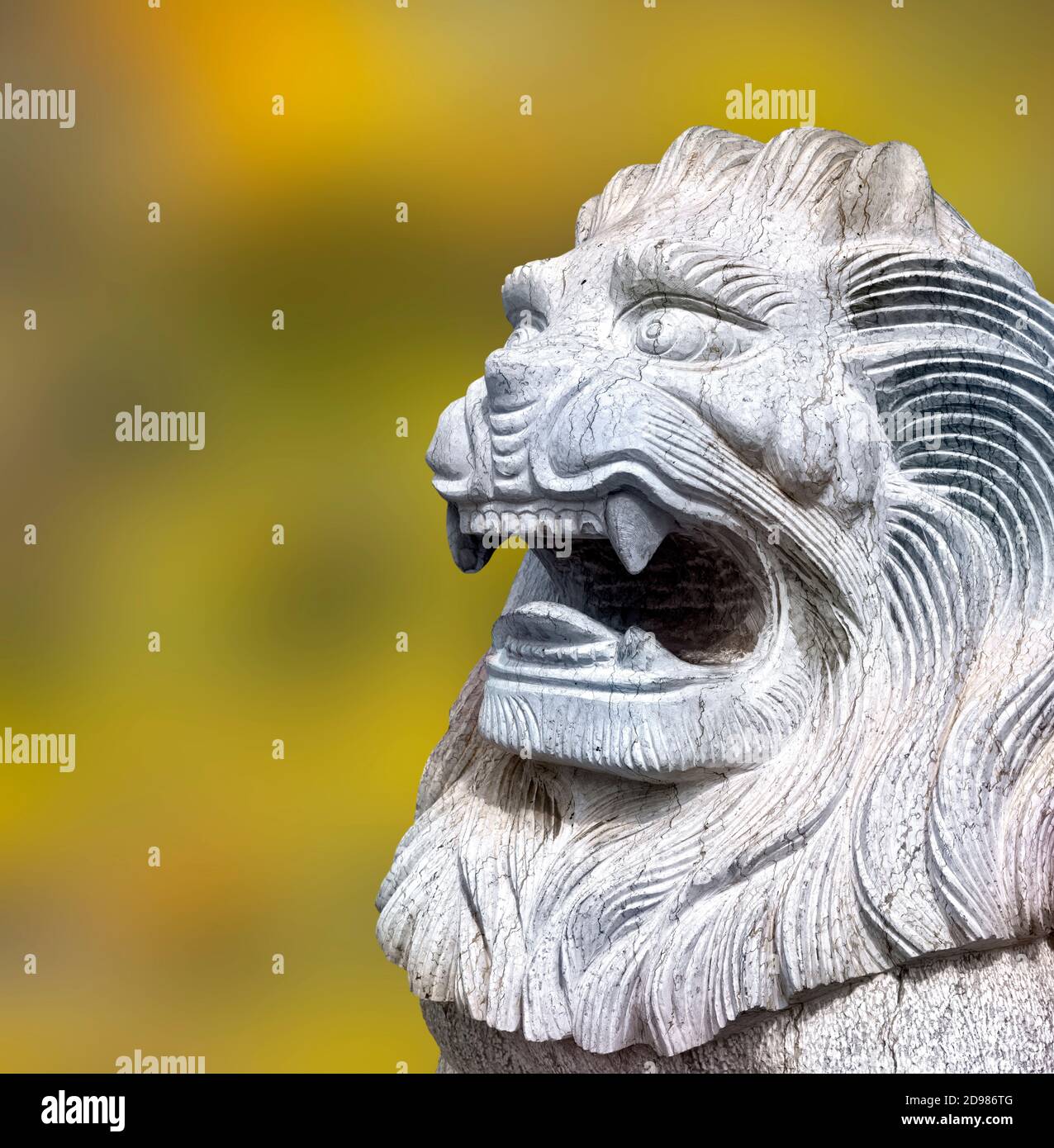Proud male lion statue, a symbol of power, in the Asian city of Guilin, Guangxi China Stock Photo