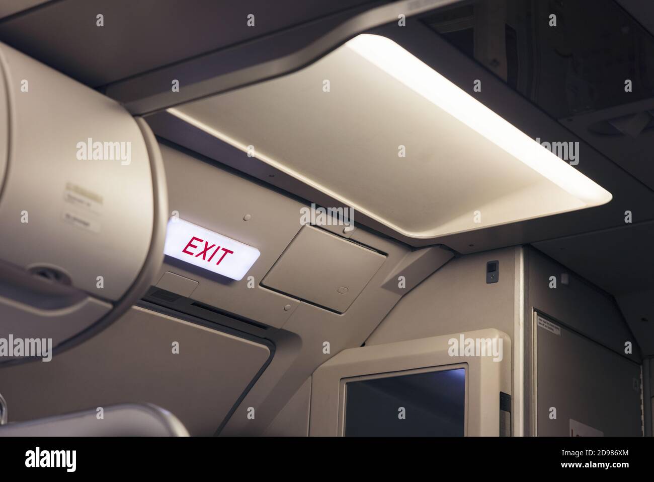 emergency exit sign and toilet sign on airplane Stock Photo