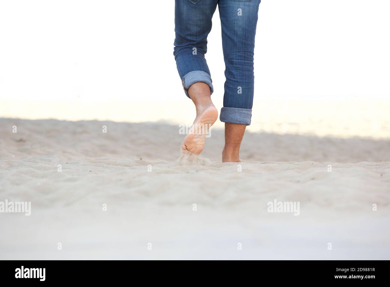 Male feet walking on sand hi-res stock photography and images - Alamy