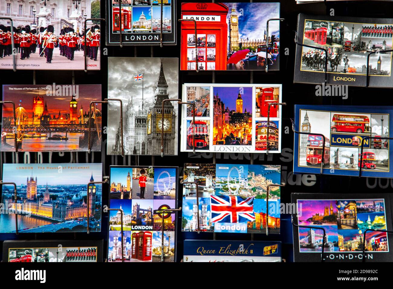 London postcards displayed on racks in front of a souvenir shop, London, UK Stock Photo