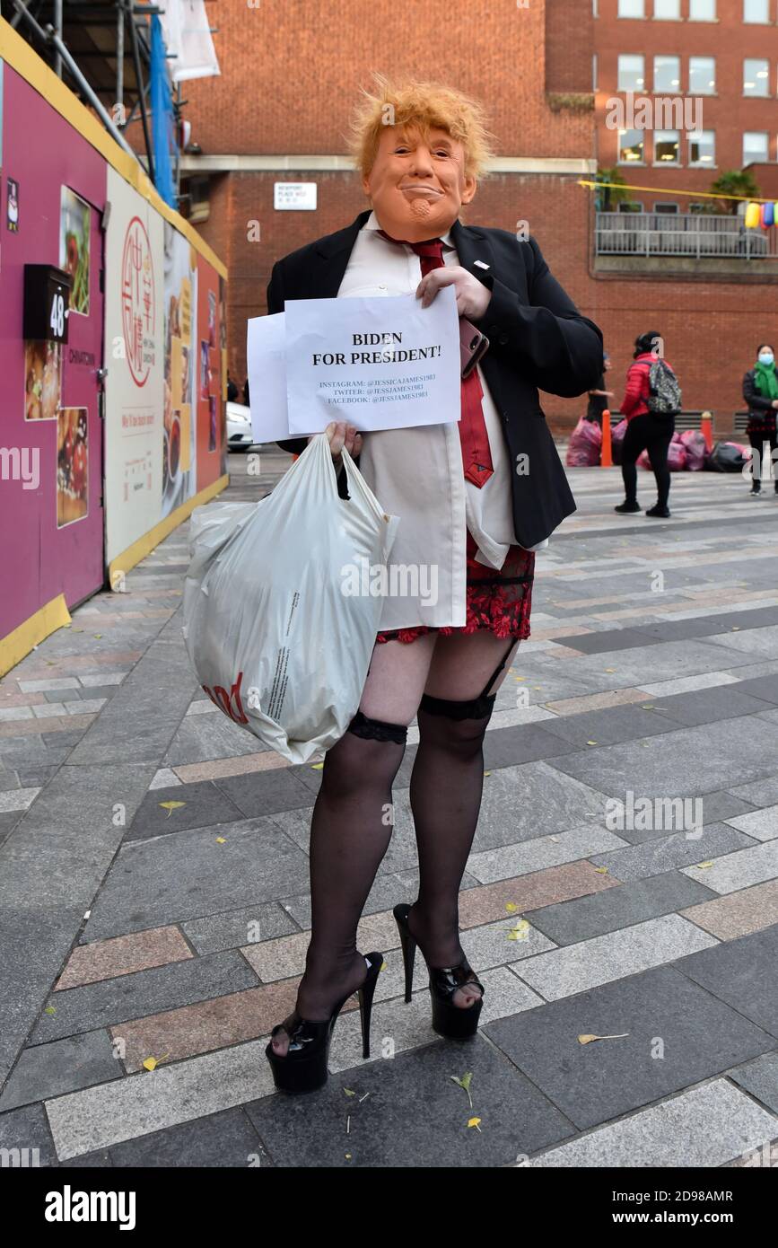 https://c8.alamy.com/comp/2D98AMR/chinatown-london-uk-3rd-nov-2020-a-man-wearing-a-donald-trump-mask-high-heels-stockings-and-suspenders-walking-through-london-credit-matthew-chattlealamy-live-news-2D98AMR.jpg