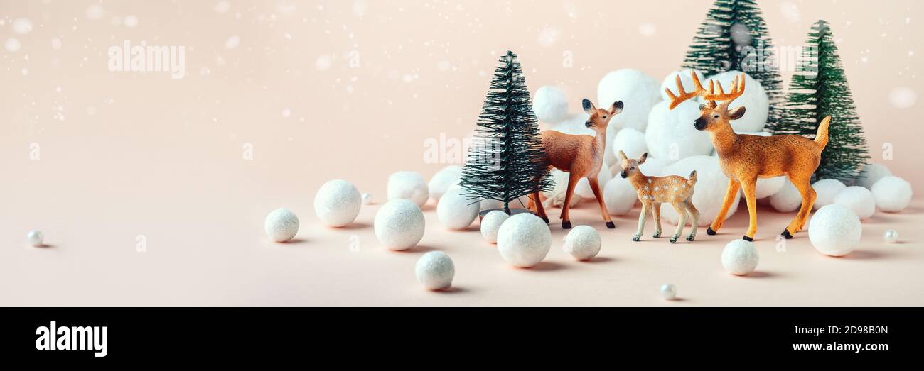 Christmas composition: a family of deer in the winter forest. New Years concept Stock Photo
