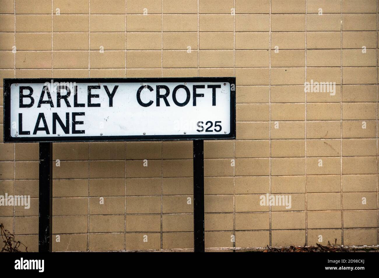 Barley Croft Lane street sign in metal against a cream painted brick
