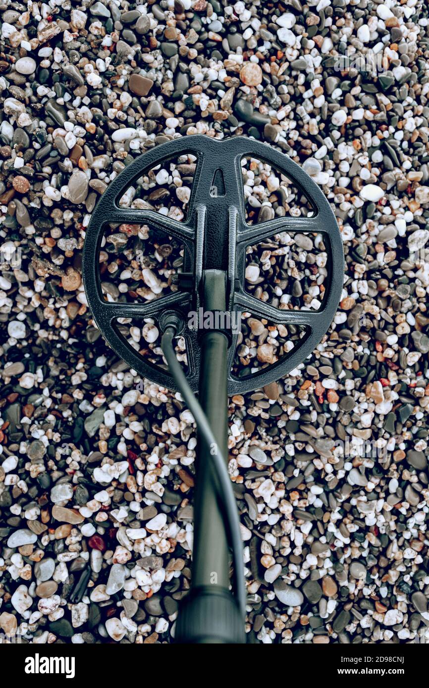 Metal detector device lying on the ground Stock Photo Alamy