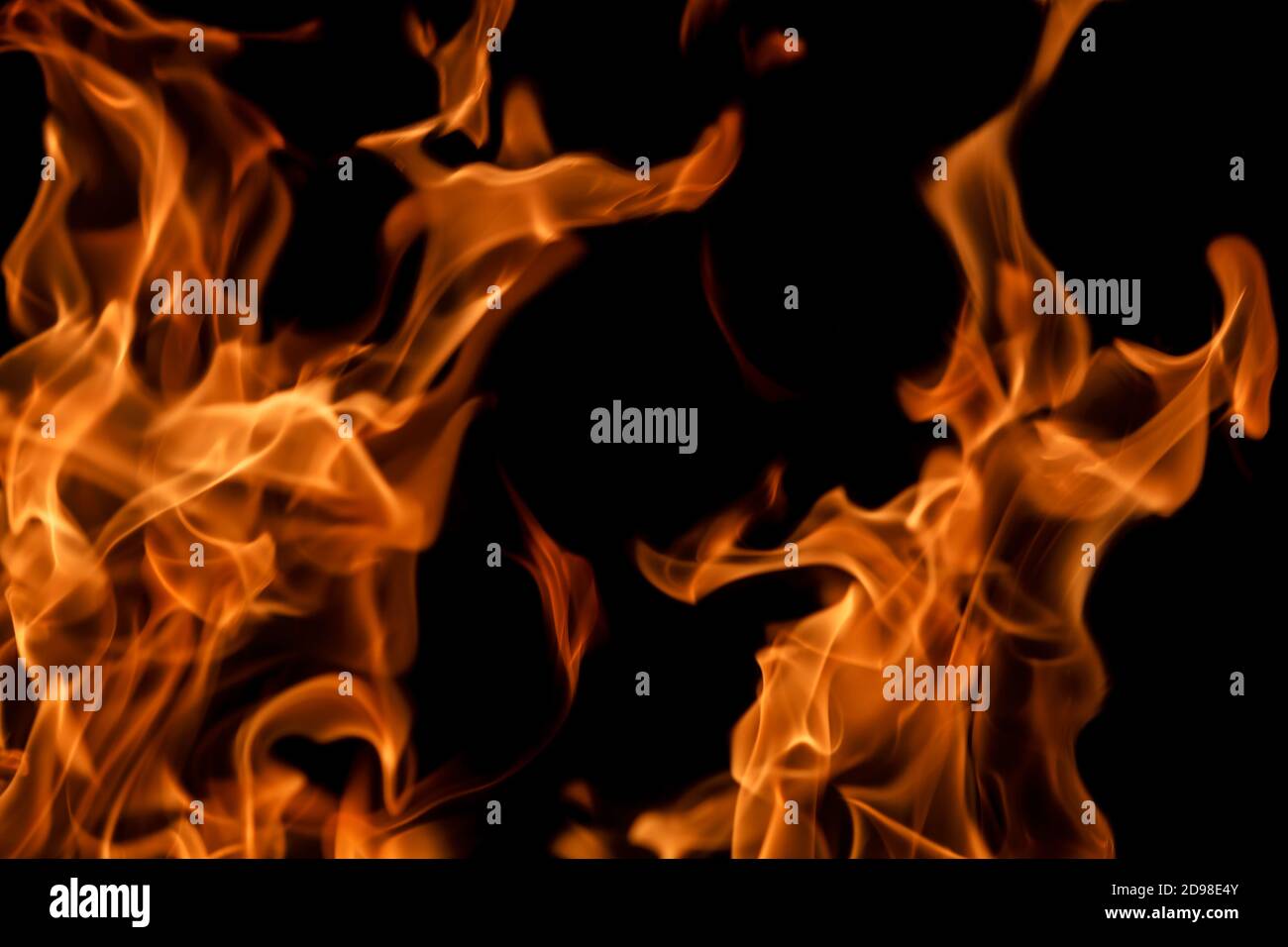 Orange fire flames on a black background Stock Photo - Alamy