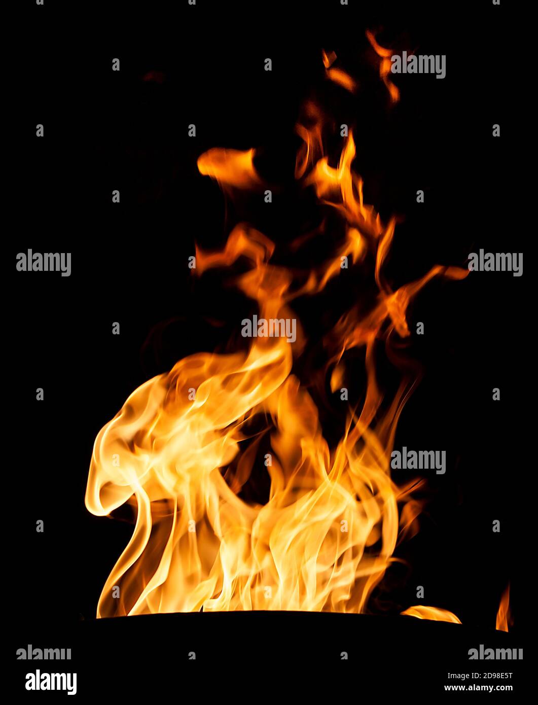 Orange fire flames on a black background Stock Photo - Alamy
