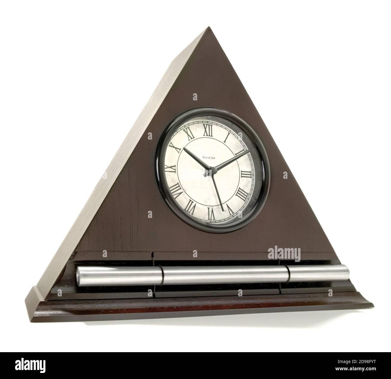 Triangleshaped analog zen alarm clock photographed on a white