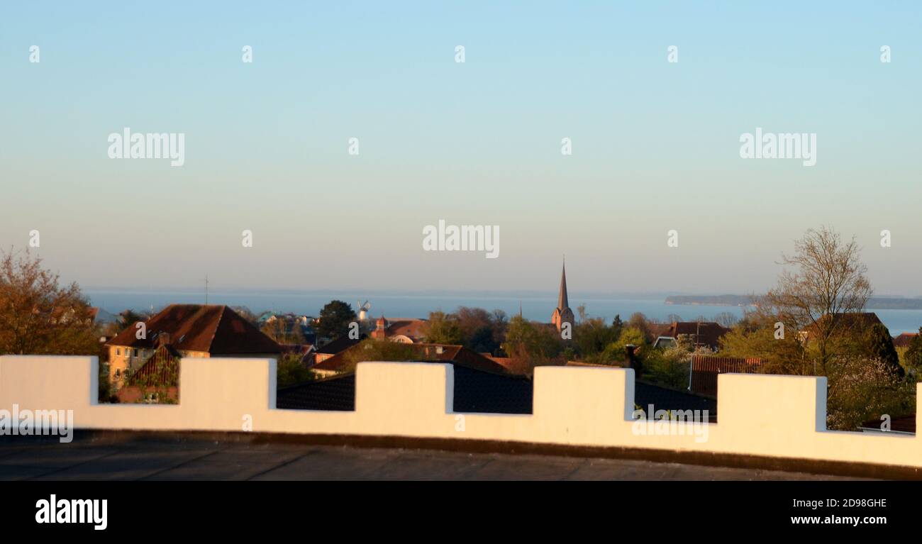 View over a town in morning light. Stock Photo