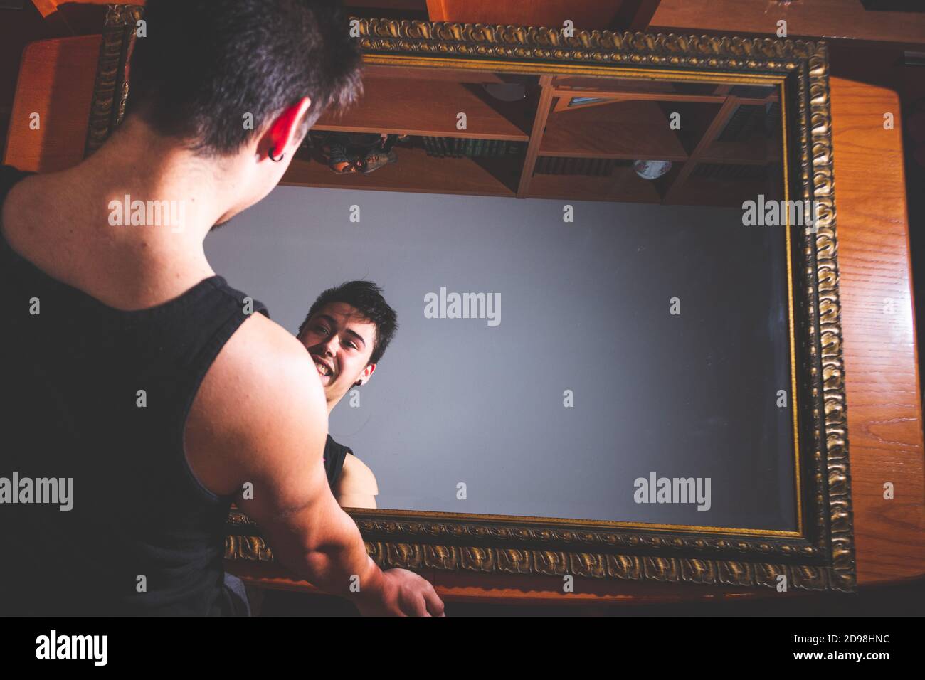 Young adult reflecting emotions on a mirror Stock Photo Alamy