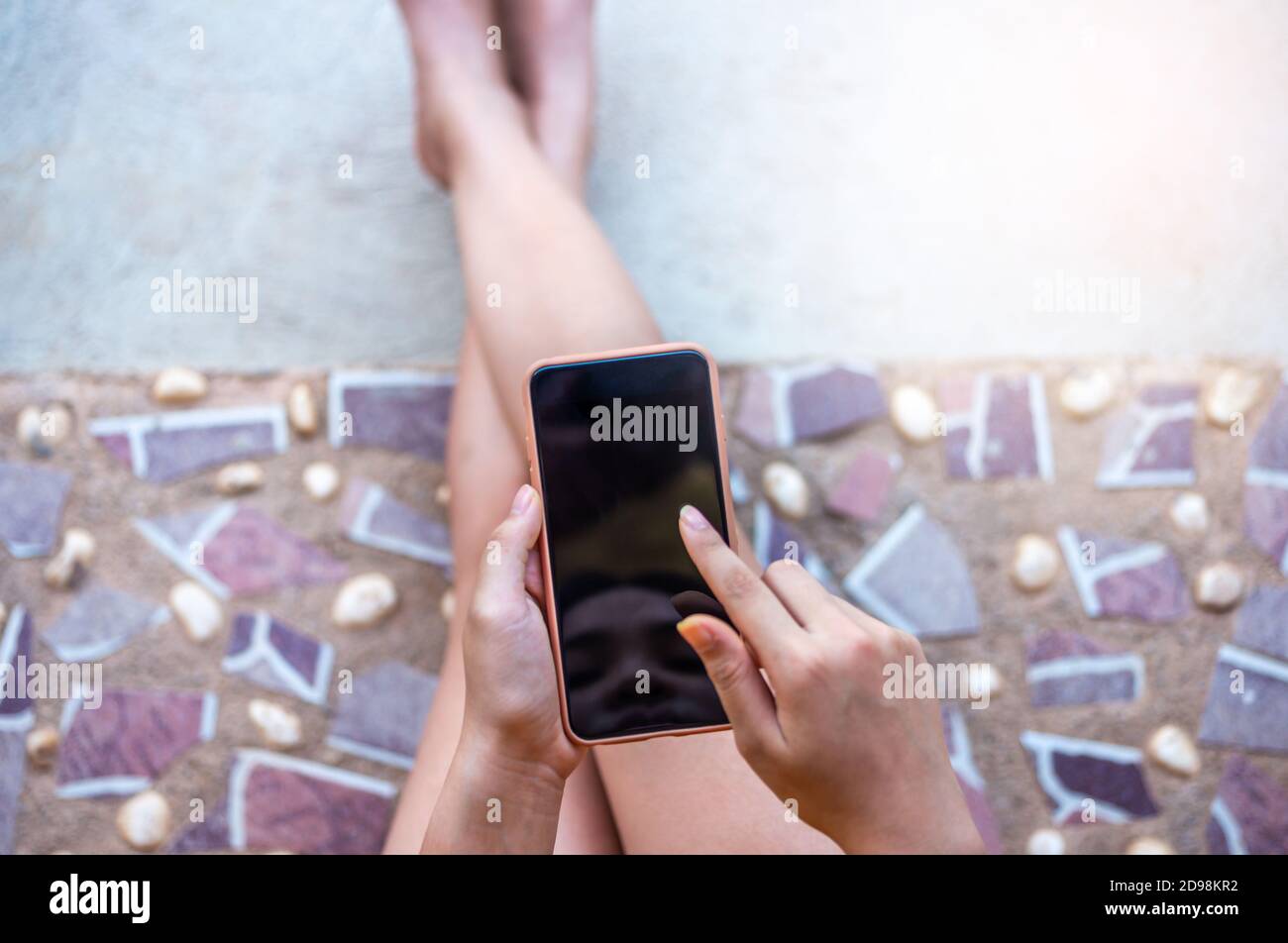 Social network and networking people concept, Hand women with smart phone mobile on blurred background, Stock Photo