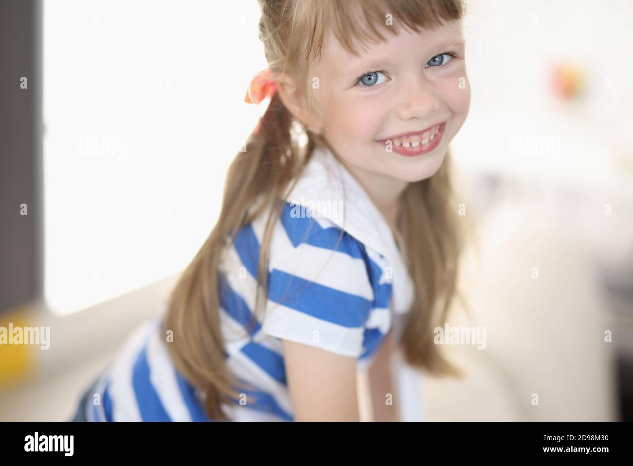 Little girl with blue eyes and blond hair portrait Stock Photo - Alamy
