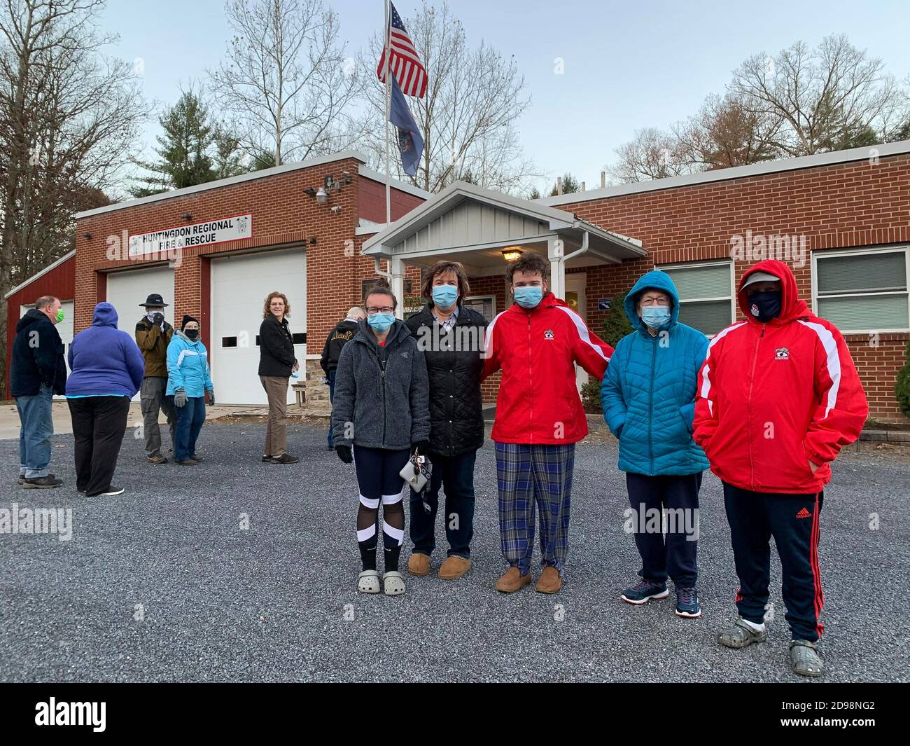 Oneida Township, Pennsylvania, USA. 3rd Nov, 2020. A three generation family arrived before the polls open, including two first-time voters, to cast their ballots together. Grandmother Mary Dempsey (second from right) is joined by Phil and Mary Jane Hawkins and new voters Brady and Jordan Hawkins. Credit: Sue Dorfman/ZUMA Wire/Alamy Live News Stock Photo