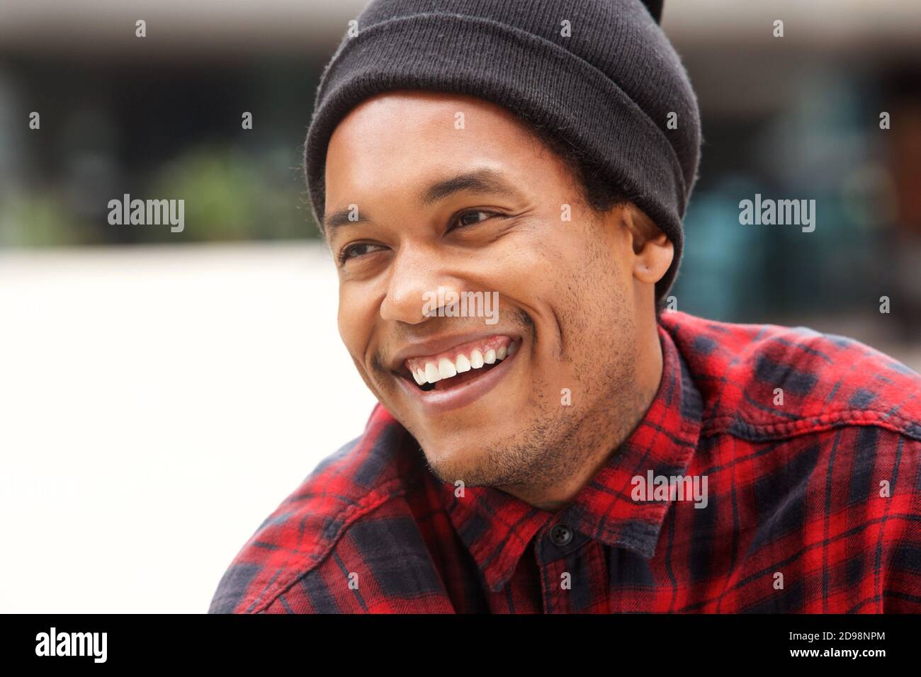 Close up portrait of handsome african american male fashion model laughing Stock Photo