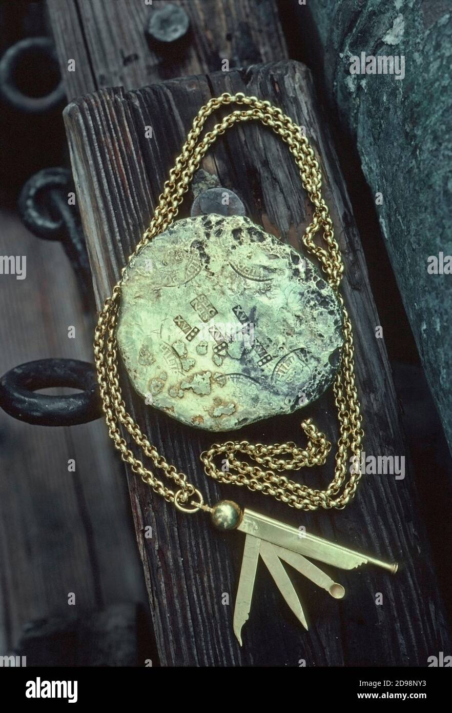 A gold ingot and a whistle set recovered from sunken Spanish wrecks in