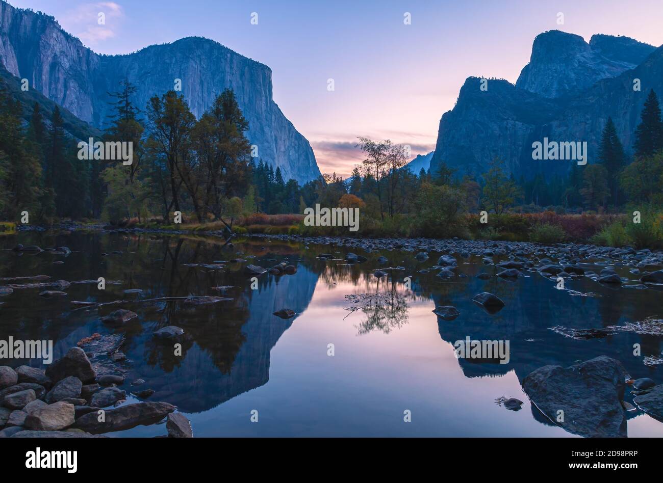 Iconic view of Yosemite Valley by the Merced River in late autumn, Yosemite National Park, California, USA, at dawn. Stock Photo