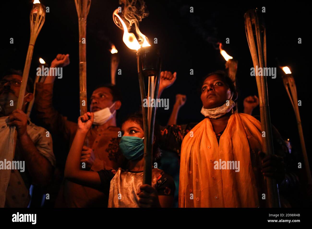 Dhaka, Dhaka, Bangladesh. 3rd Nov, 2020. Progressive organizations have taken out torch procession demanding justice for the burning of people in Lalmonirhat and the attack on the houses of the Hindu community in Muradnagar, Comilla, on charges of insulting religion during the COVID-19 pandemic on 3rd November, 2020. Credit: Md. Rakibul Hasan/ZUMA Wire/Alamy Live News Stock Photo