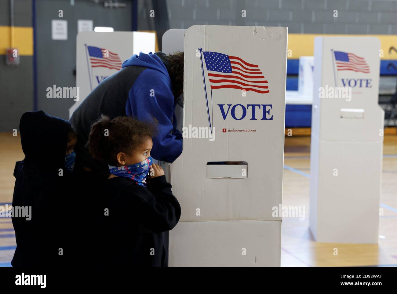 A voter fills out a ballot on Election Day in Conshohocken, Pennsylvania, U.S., November 3, 2020. REUTERS/Rachel Wisniewski Stock Photo