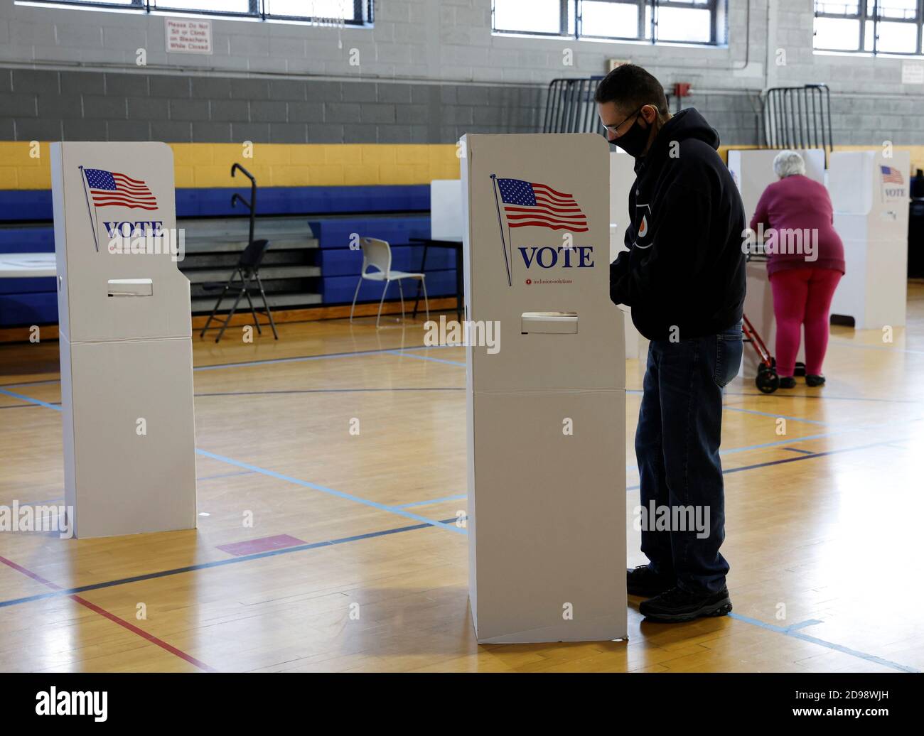 Voters fill out their ballots on Election Day in Conshohocken, Pennsylvania, U.S., November 3, 2020. REUTERS/Rachel Wisniewski Stock Photo