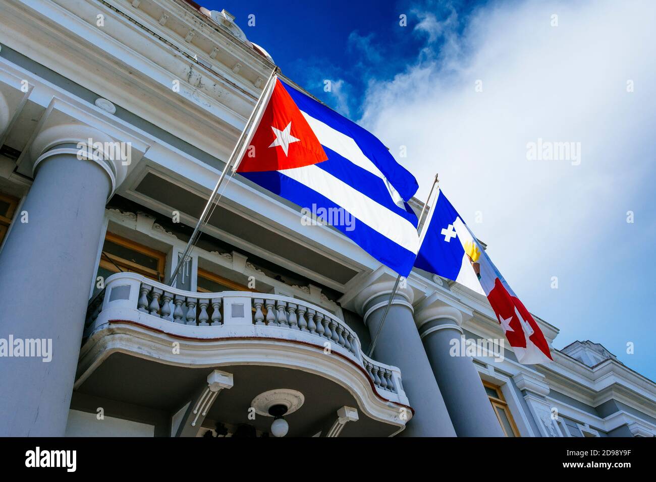 Detail. Cuban flag waving on the facade of Palacio de Gobierno - Government Palace - City Hall and Provincial Museum. Cienfuegos, Cuba, Latin America Stock Photo