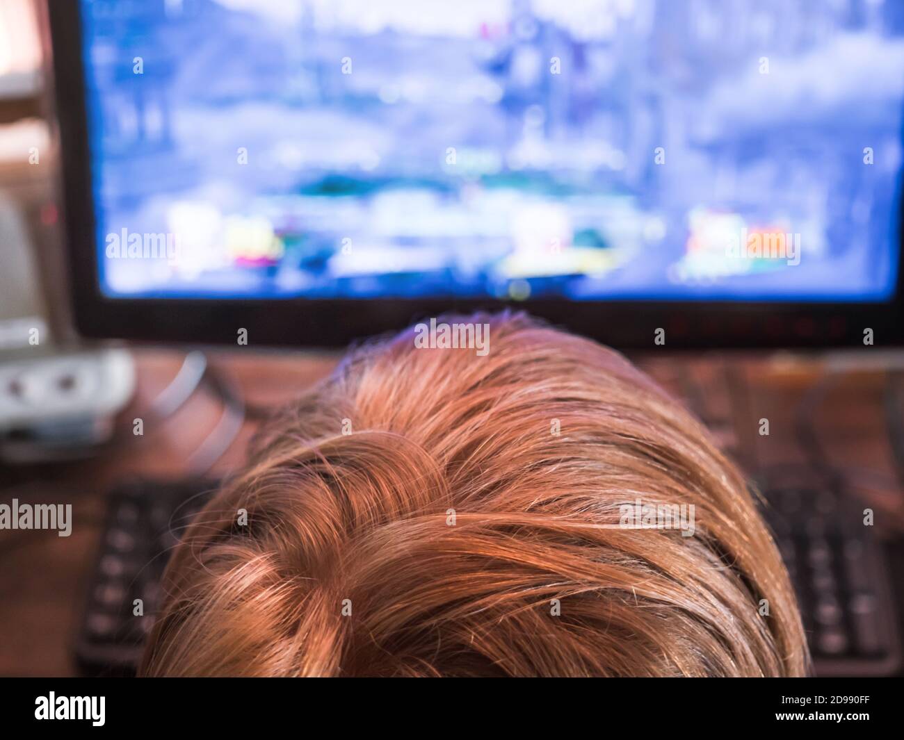 Little kid playing emulated videogame on PC Stock Photo - Alamy