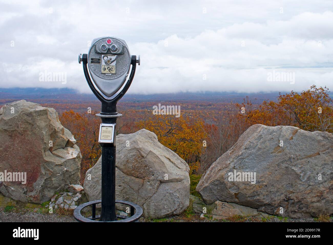 Cloudy skies, large stones, and lush Autumn foliage at High Point Monument area of High Point State Park in New Jersey, USA -02 Stock Photo