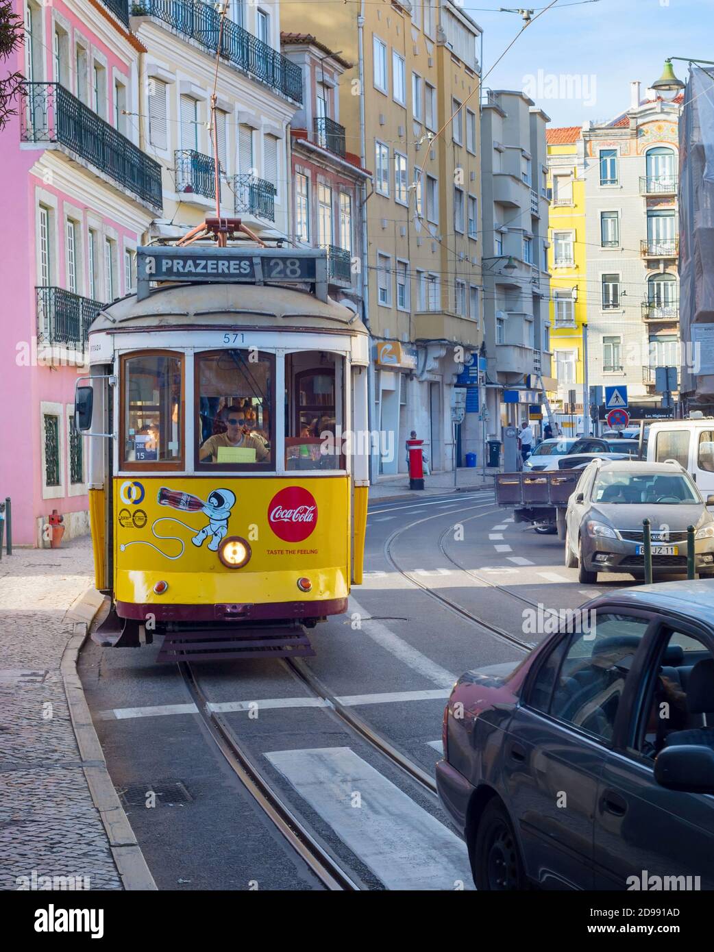 LISBON, PORTUGAL - SEPT 18, 2018: Famous old-fashioned tram 28 on a narrow Lisbon street, Portugal Stock Photo