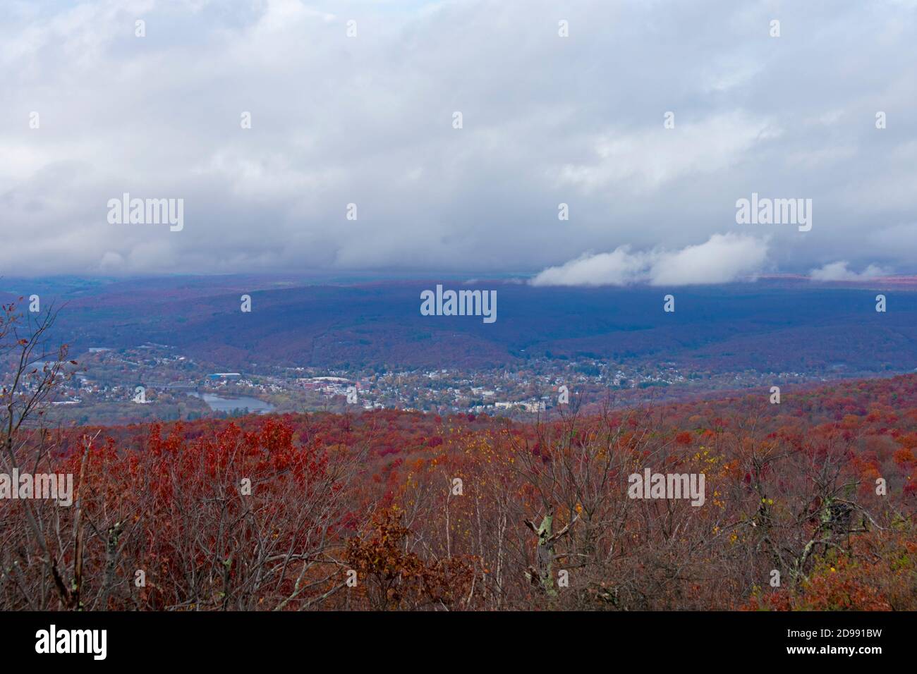 Cloudy skies, the town of Port Jervis, in New Yor, and lush Autumn foliage at High Point Monument area of High Point State Park in New Jersey, USA -05 Stock Photo